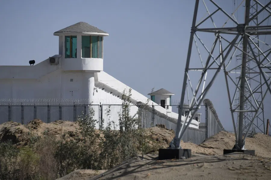 This photo taken on 31 May 2019 shows watchtowers on a high-security facility near what is believed to be a re-education camp where mostly Muslim ethnic minorities are detained, on the outskirts of Hotan, Xinjiang, China. (Greg Baker/AFP)