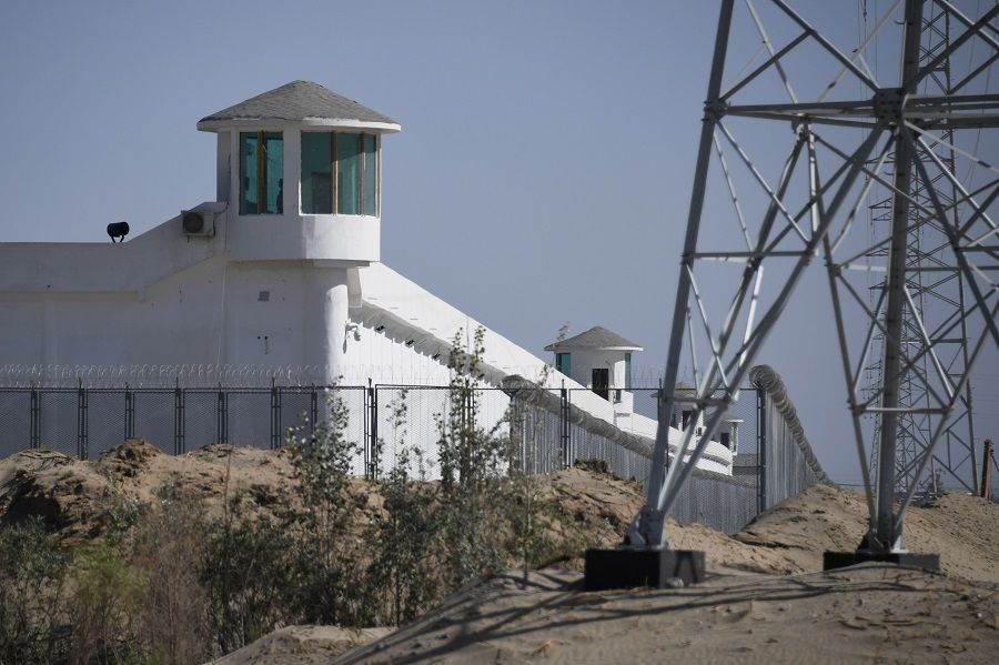 This photo taken on 31 May 2019 shows watchtowers on a high-security facility near what is believed to be a re-education camp where mostly Muslim ethnic minorities are detained, on the outskirts of Hotan, Xinjiang, China. (Greg Baker/AFP)