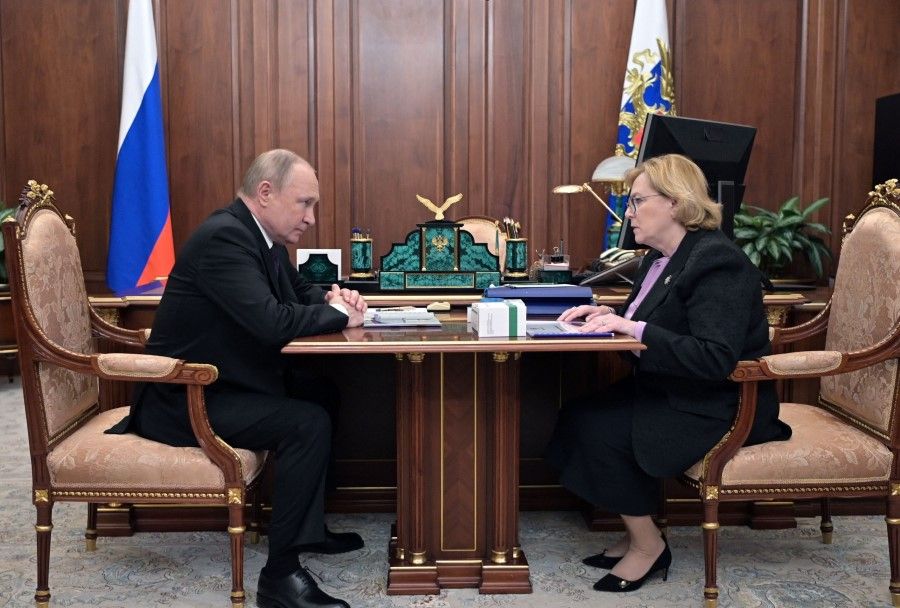 Russian President Vladimir Putin meets with Veronika Skvortsova, the head of the Russian Federal Medical-Biological Agency, at the Kremlin in Moscow on 15 March 2022. (Mikhail Klimentyev/Sputnik/AFP)