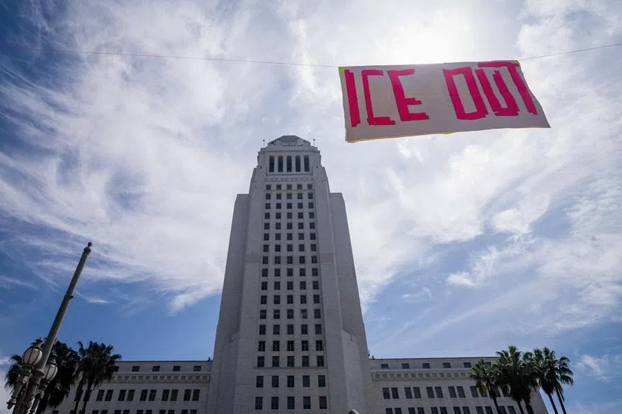 A banner reading "ICE OUT" hangs in front of City Hall during a No Kings protest against US President Donald Trump's administration policies, in Los Angeles, California, US, 28 March 2026.