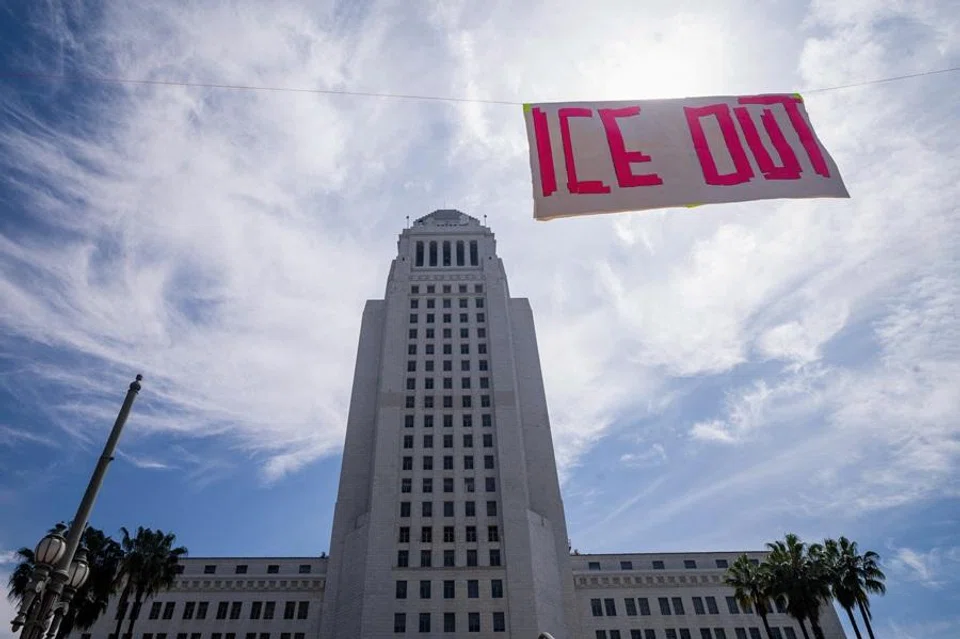 A banner reading "ICE OUT" hangs in front of City Hall during a No Kings protest against US President Donald Trump's administration policies, in Los Angeles, California, US, 28 March 2026. (Ringo Chiu/Reuters)