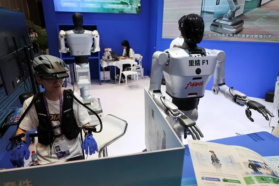 An employee demonstrates the working of a humanoid robot during the China Import and Export Fair, in Guangzhou, Guangdong province, China, on 15 April 2026.