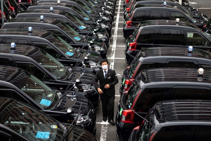 This picture taken on 7 July 2021 shows vehicles in Tokyo. (Philip Fong/AFP)