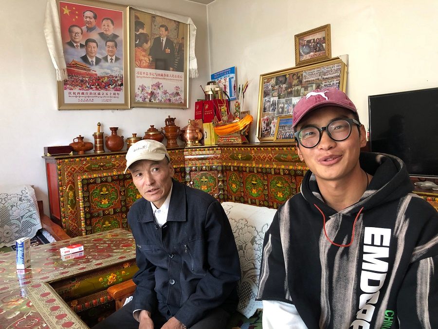 Young Tibetan Danzeng Duoji (right) has no plans to go back to the farm.