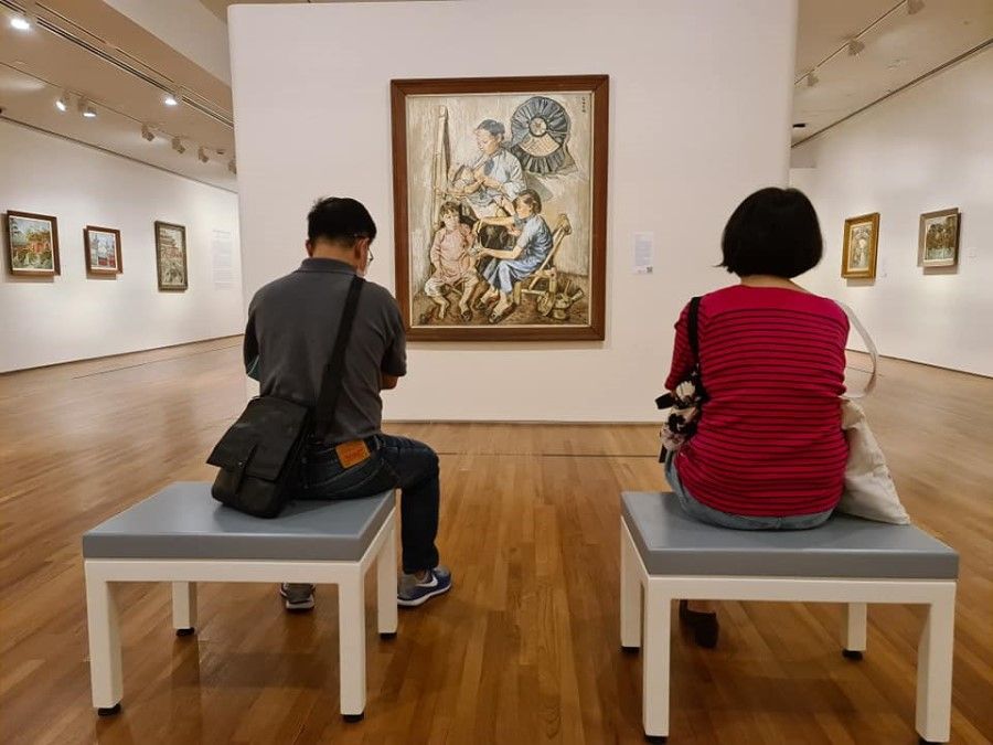 Visitors look at the works of Georgette Chen at an exhibition at the National Gallery of Singapore, 2021. (SPH Media)