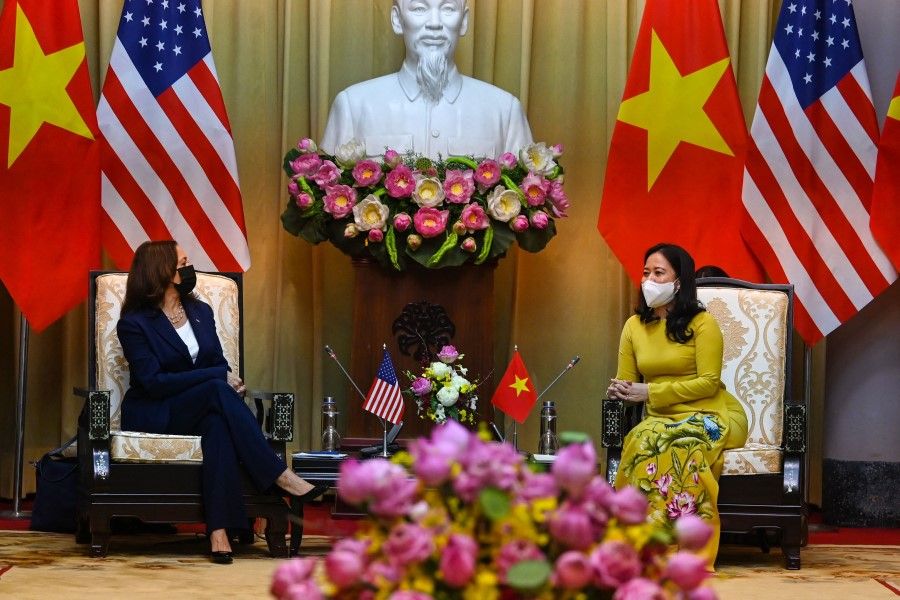 US Vice President Kamala Harris (L) talks to Vietnam's Vice President Vo Thi Anh Xuan at the Presidential Palace in Hanoi on 25 August 2021. (Manan Vatsyayana/AFP)
