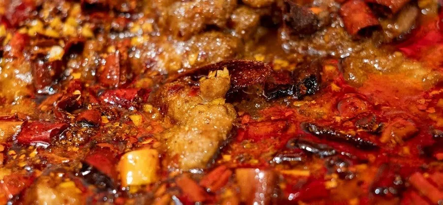 According to Fuscia Dunlop, author of Sharks Fin and Sichuan Pepper, food from other provinces such as Chongqing, Hunan and Jiangxi is much spicier than Sichuan. “Chillies are used not in violence, but to awaken and stimulate the palate… an undercurrent of sweetness, a robust beany savouriness, a splash of mellow vinegar-sour, to seduce and delight.” (Patrick Fleming)