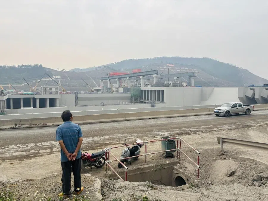 A villager looks on at the construction site of the Pinglu Canal. (Lim Zhan Ting/SPH Media)