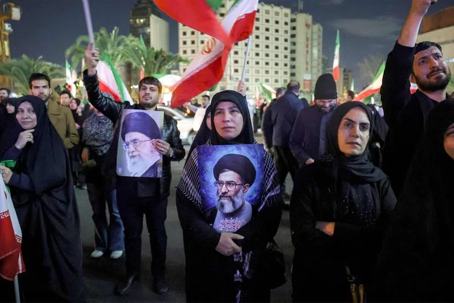 A mourner holds a picture of Iran’s supreme leader Ali Khamenei at a memorial vigil, a day after his assassination in joint US and Israeli strikes, in Tehran on 1 March 2026. (AFP)