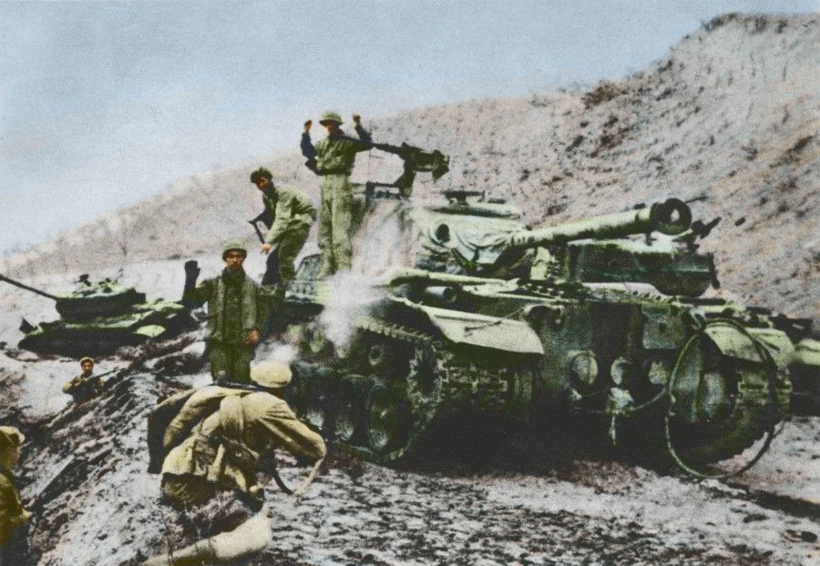 Volunteer troops surrounding and attacking a US tank with RPG-43 anti-tank grenades, forcing the US soldiers to come out of the tank and surrender.