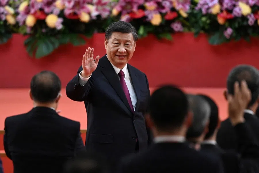 China's President Xi Jinping waves following his speech after a ceremony to inaugurate the city's new leader and government in Hong Kong, China, 1 July 2022, on the 25th anniversary of the city's handover from Britain to China. (Selim Chtayti/Reuters)