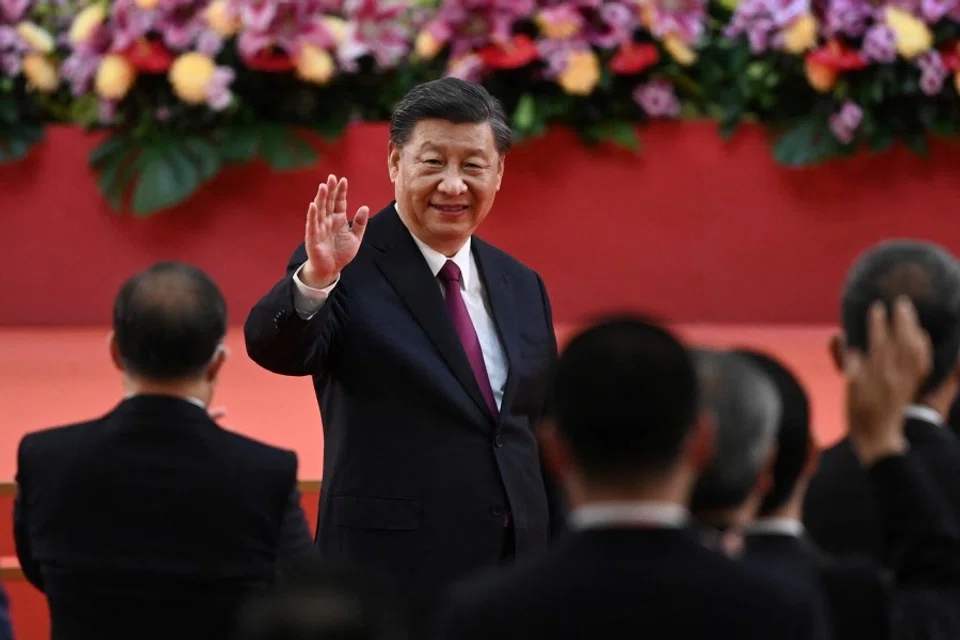 China's President Xi Jinping waves following his speech after a ceremony to inaugurate the city's new leader and government in Hong Kong, China, 1 July 2022, on the 25th anniversary of the city's handover from Britain to China. (Selim Chtayti/Reuters)