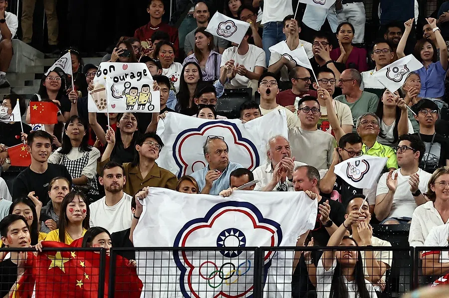 Supporters holding Chinese Taipei Olympic flags in the stands during the men’s doubles badminton gold medal match at the Paris 2024 Olympics, on 4 August 2024.