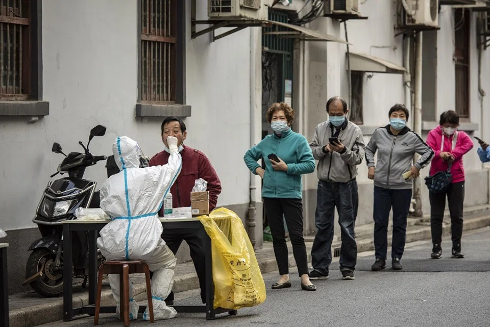 Residents queue at a Covid-19 testing station in Shanghai, China, on 6 November 2022. (Qilai Shen/Bloomberg)