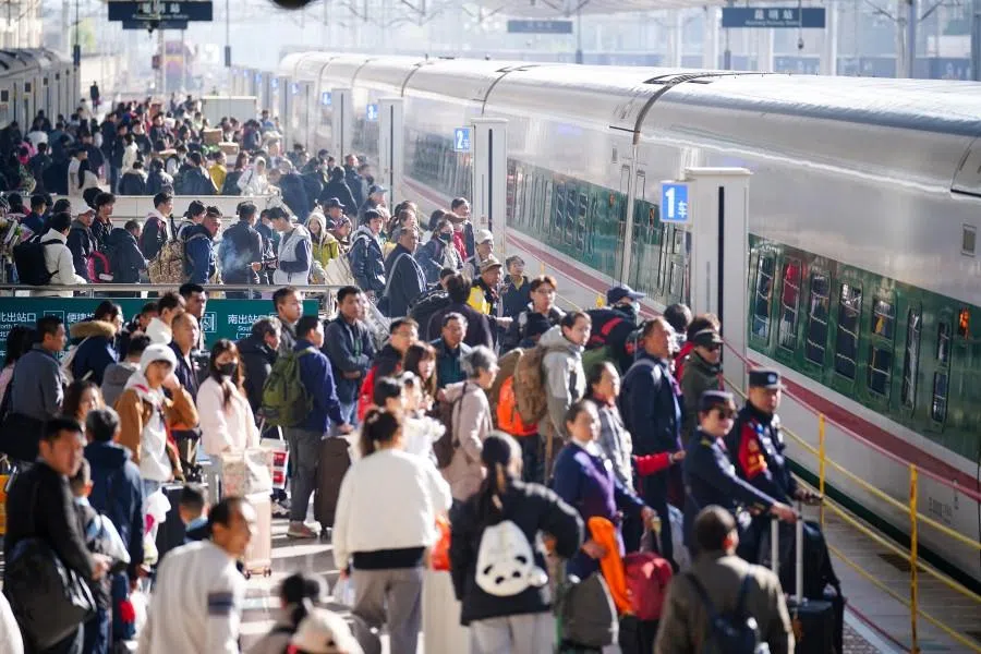 People on the platform at the train station in Yunnan. (CNS)