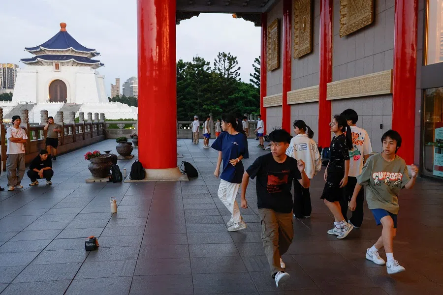 People dance at the Chiang Kai-shek Memorial Hall in Taipei, Taiwan, on 16 May 2024. (Ann Wang/Reuters)