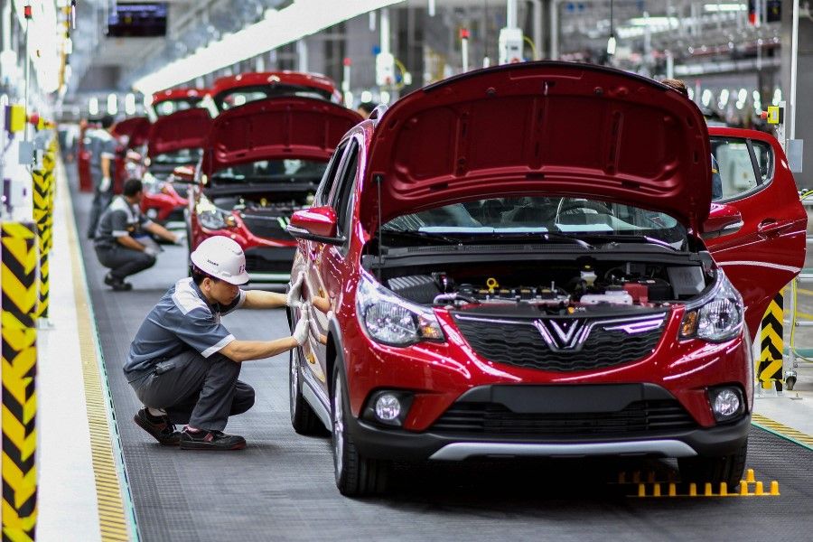 In this file photo taken on 14 June 2019, workers operate the car assembly line at the automobile plant of VinFast, Vietnam's first homegrown car manufacturer, in Haiphong. (Manan Vatsyayana/AFP)