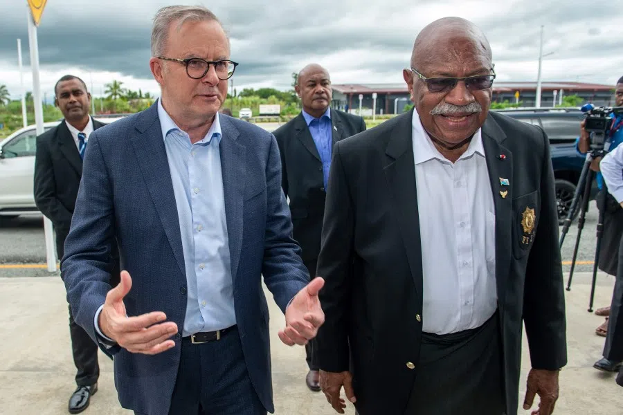 Fiji's Prime Minister Sitiveni Rabuka (right) receives his Australian counterpart Anthony Albanese (left) upon the latter's arrival in Nadi on 15 March 2023. (Leon Lord/AFP)