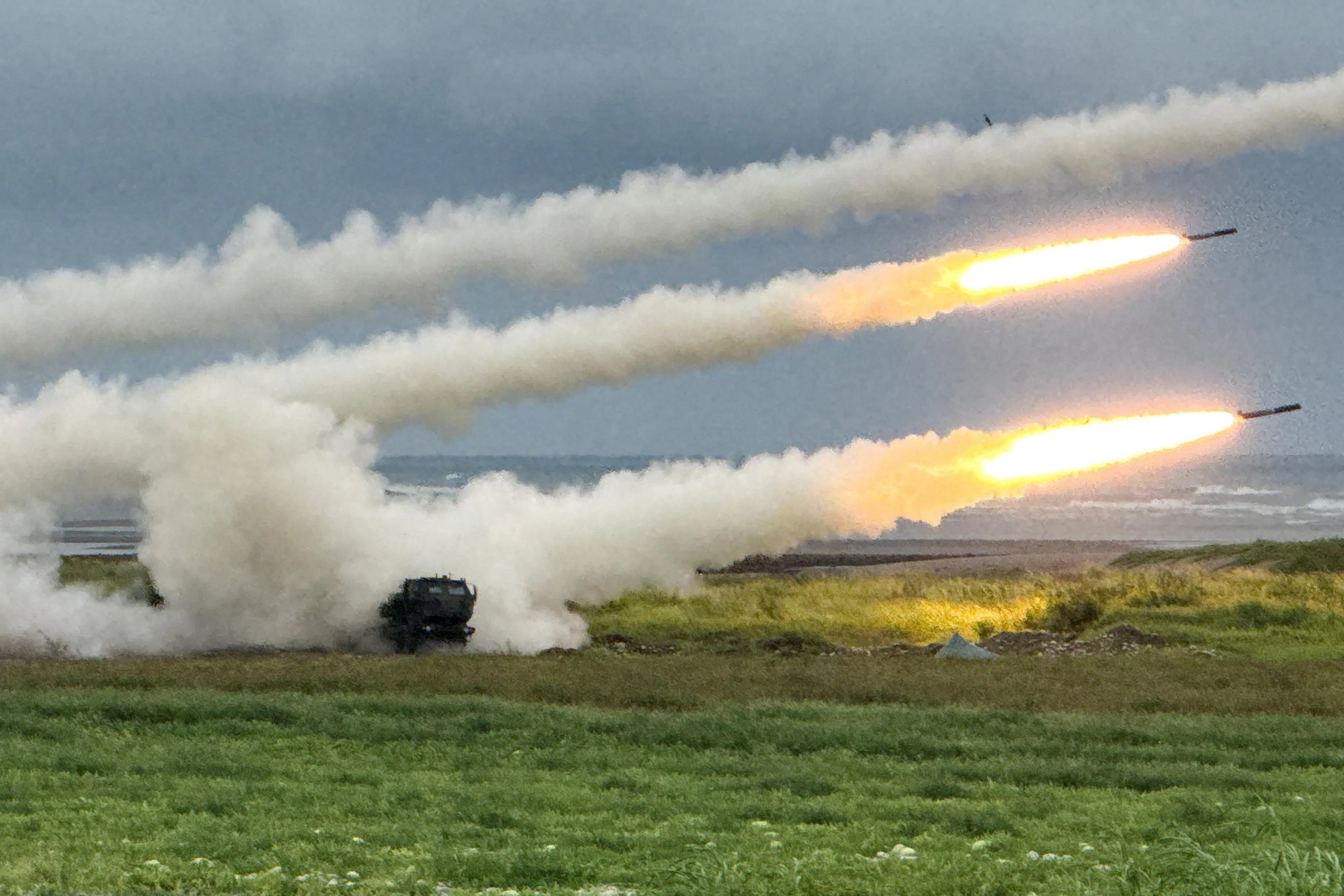 Taiwan's High Mobility Artillery Rocket Systems (HIMARS) fire rockets during a live-fire military exercise in Taichung, Taiwan, 10 June 2026.