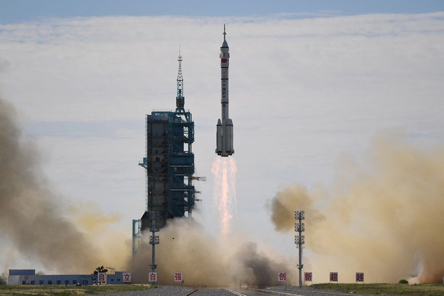 A Long March-2F carrier rocket, carrying the Shenzhou-12 spacecraft and a crew of three astronauts, lifts off from the Jiuquan Satellite Launch Centre in the Gobi desert, China on 17 June 2021, the first crewed mission to China's new space station. (Greg Baker/AFP)