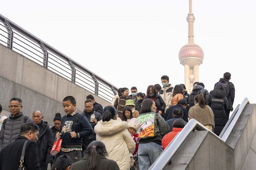 Shoppers near the Bund in Shanghai, China, on 11 February 2024. (Raul Ariano/Bloomberg)