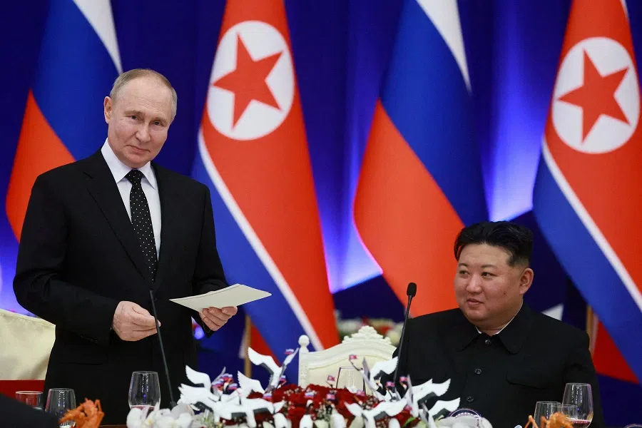 Russia’s President Vladimir Putin and North Korea’s leader Kim Jong Un attend a state reception in Pyongyang, North Korea, on 19 June 2024. (Sputnik/Vladimir Smirnov/Pool via Reuters)