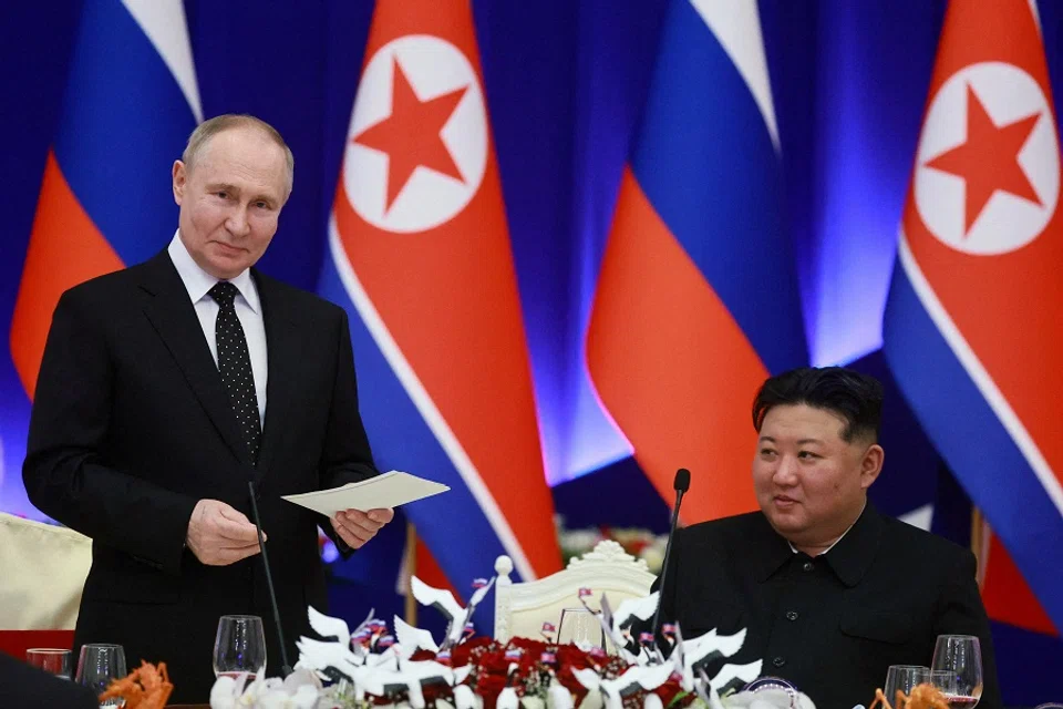 Russian President Vladimir Putin and North Korean leader Kim Jong Un attend a state reception in Pyongyang, North Korea, on 19 June 2024. (Sputnik/Vladimir Smirnov/Pool via Reuters)