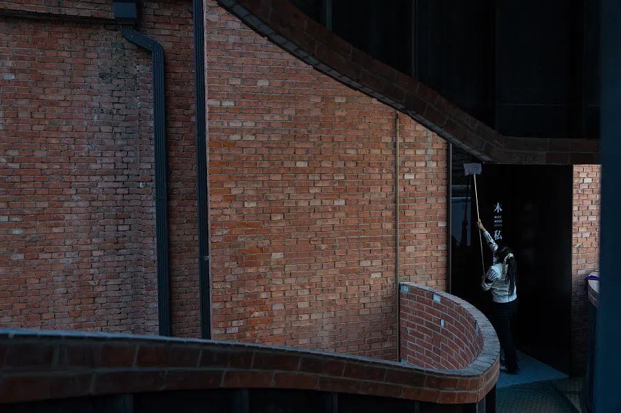 At 7 am, Sister Chen cleans at an interior design company.