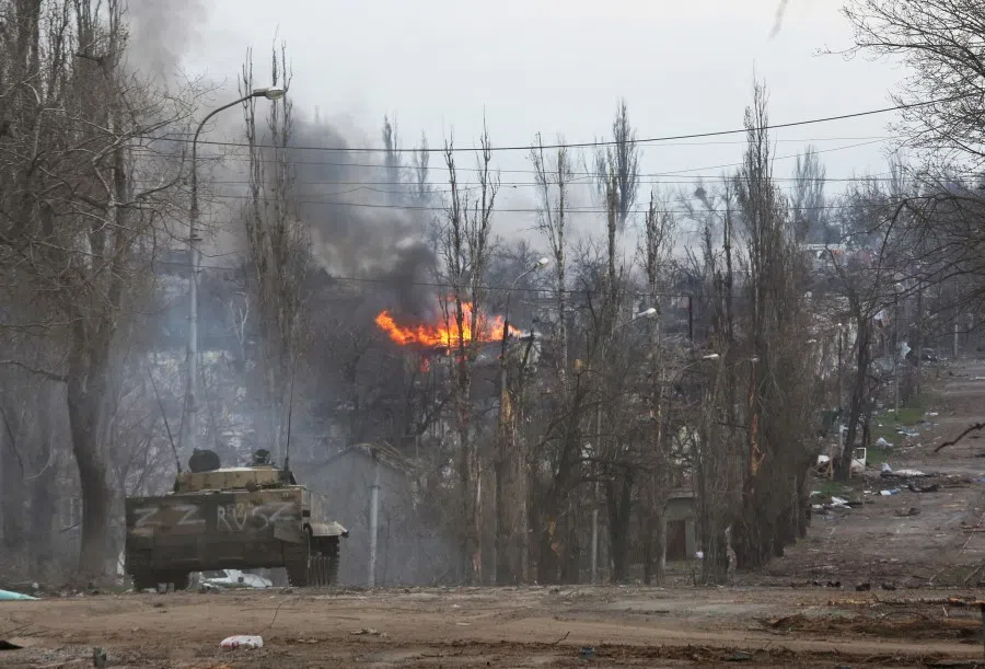 An armoured vehicle of pro-Russian troops is seen in the street during Ukraine-Russia conflict in the southern port city of Mariupol, Ukraine, 11 April 2022. (Chingis Kondarov/Reuters)