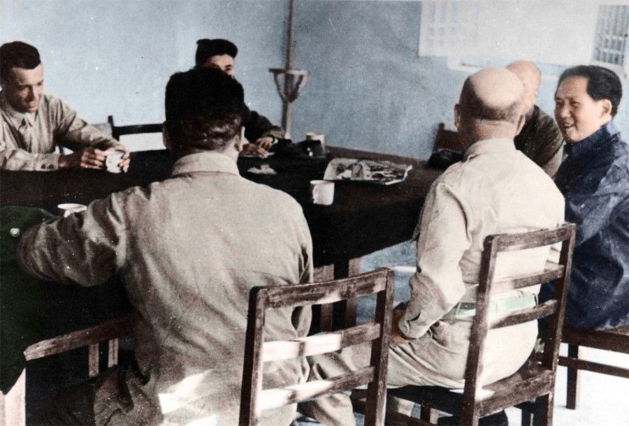 Mao Zedong exchanging views on the war resistance with members of the Dixie Mission, 1944.