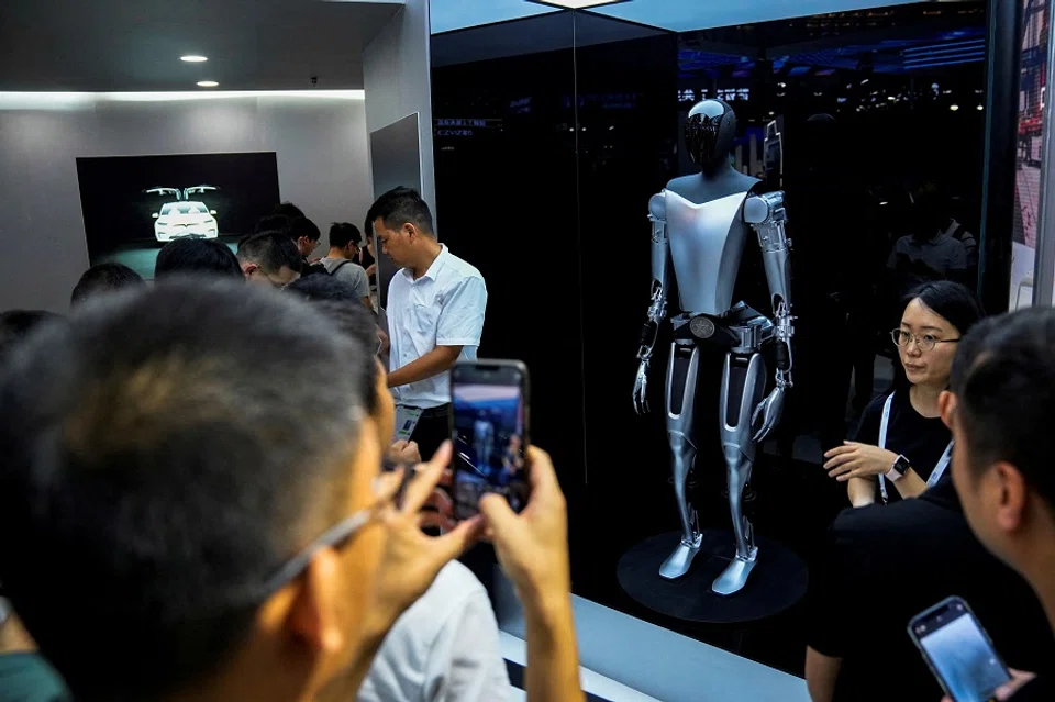 A Tesla Bot on display at the World Artificial Intelligence Conference in Shanghai, China, on 6 July 2023. (Aly Song/Reuters)