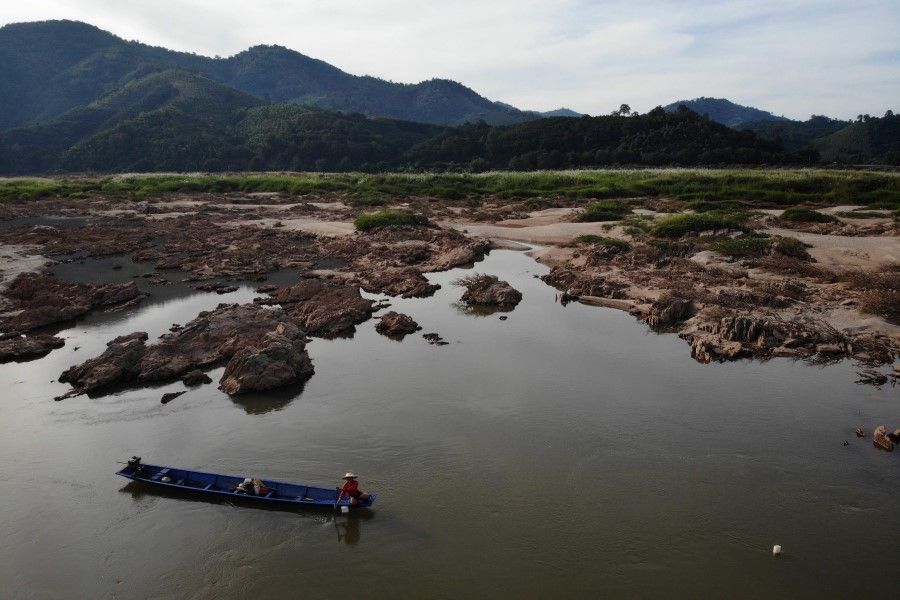 In this aerial file photo taken on October 31, 2019 shows a fisherman on a boat in Mekong River in Pak Chom district in the northeastern Thai province of Loei. (Lillian Suwanrumpha/AFP)