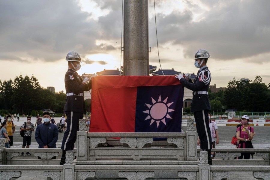 The flag lowering ceremony at the Chiang Kai-shek Memorial Hall in Taipei, Taiwan, on 2 July 2022. (Lam Yik Fei/Bloomberg)