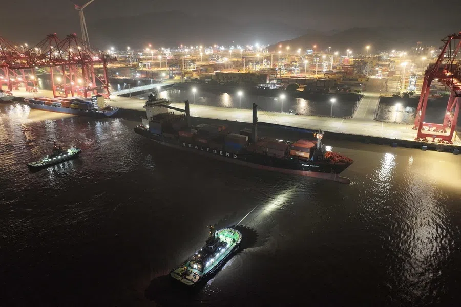This handout photo taken and released on 15 August 2026 by the Ningbo Zhoushan Port Group shows the Dubai Tower container ship, operated by Chinese shipowner Sea Legend, setting sail from the port of Ningbo headed to the port of Felixstow, England.