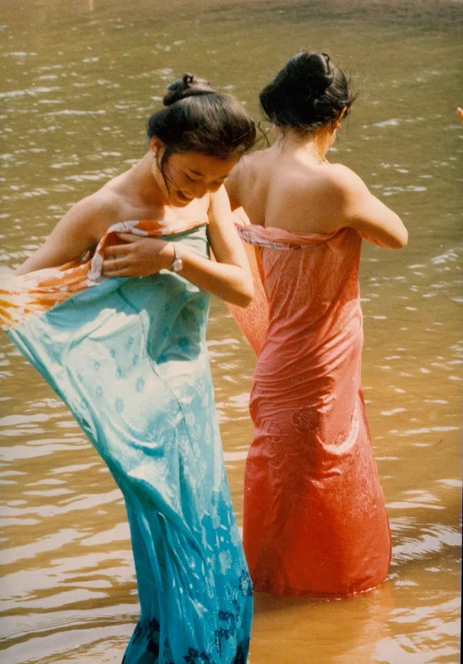 Dai women bathing in the river, 1987.