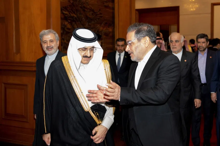 Secretary of Iran's Supreme National Security Council Ali Shamkhani talks with Minister of State and national security adviser of Saudi Arabia Musaad bin Mohammed Al Aiban during a meeting in Beijing, China, 10 March 2023. (cnsphoto via Reuters)