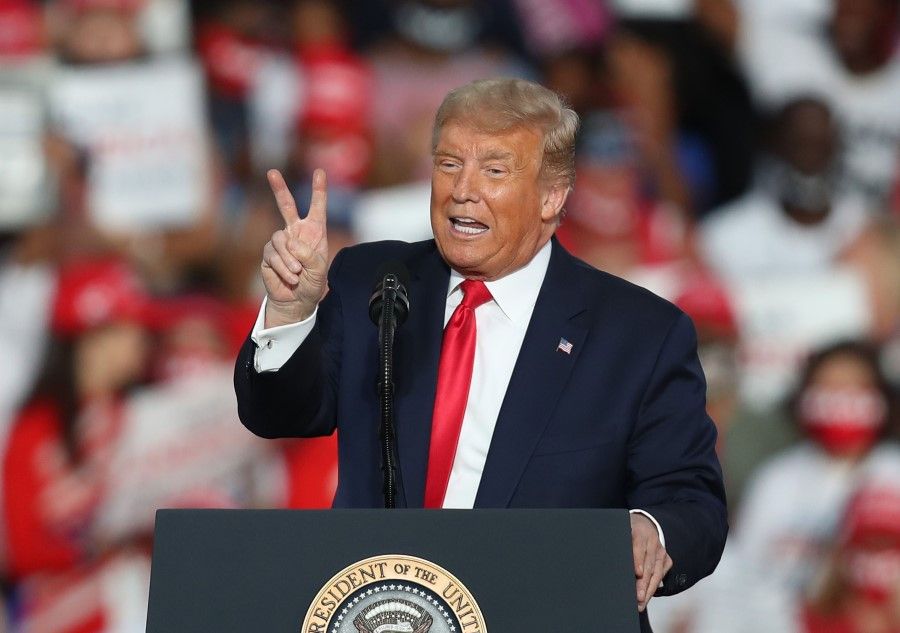 President Donald Trump speaks during his campaign event at the Orlando Sanford International Airport on 12 October 2020 in Sanford, Florida. (Joe Raedle/AFP)
