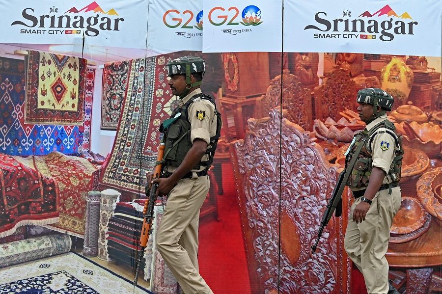 Indian paramilitary troopers patrol at Polo View market before the visit of G20 delegates in Srinagar on 24 May 2023. (Tauseef Mustafa/AFP)