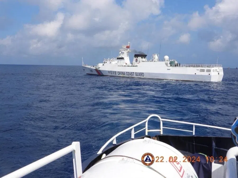 This handout photo taken on 22 February 2024 and received on 25 February 2024 from the Philippine Coast Guard shows a China Coast Guard vessel sailing near the China-controlled Scarborough Shoal in the disputed South China Sea. (Handout/Philippine Coast Guard (PCG)/AFP)