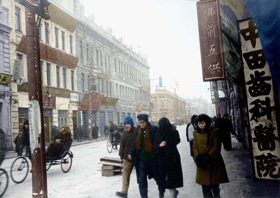 The streets of Harbin in Manchuria, winter 1945. This ancient town was occupied by Russia in modern history and shows a Russian influence. Later, it was colonised by Japan, and so shows a mix of various cultural elements.