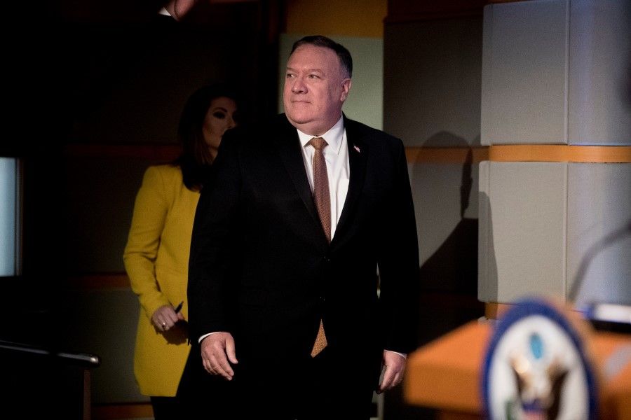 U.S. Secretary of State Mike Pompeo, accompanied by State Department spokeswoman Morgan Ortagus, arrives to speak at a news conference at the State Department in Washington, 15 July 2020. (Andrew Harnik/REUTERS)