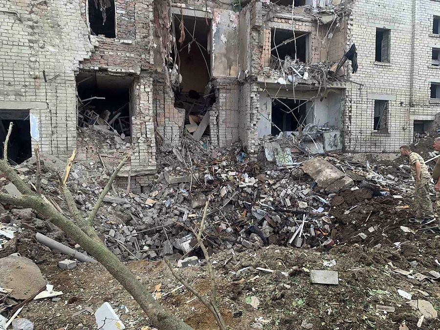 This handout picture taken and released by the Ukrainian State Emergency Service on 20 August 2022 shows a destroyed residental building after shelling in Voznesensk, Ukraine, amid the Russian invasion of Ukraine. (Handout/Ukrainian State Emergency Service/AFP)