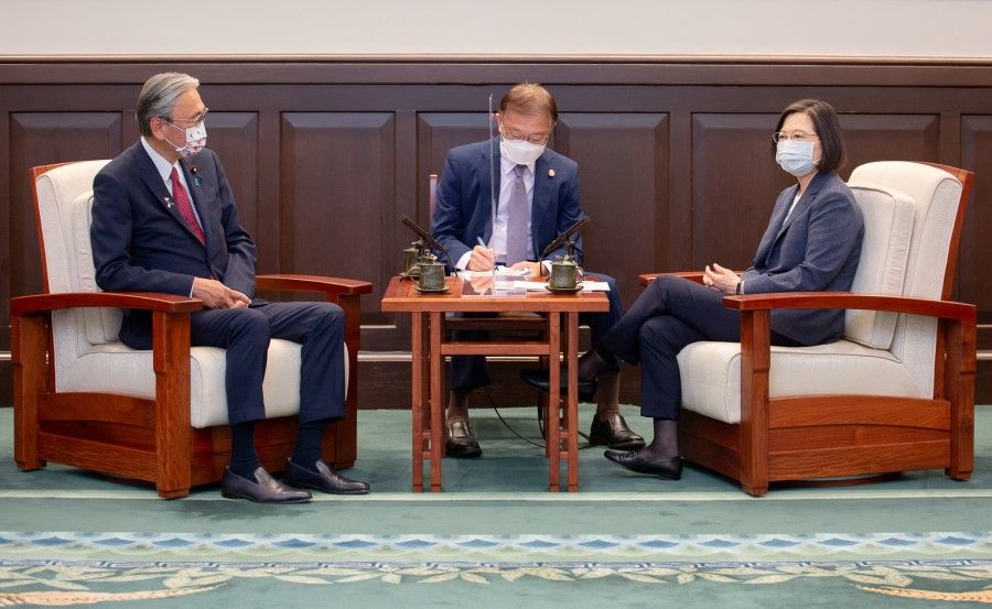 Taiwan President Tsai Ing-wen speaks to Member of the House of Representatives of Japan Keiji Furuya at the presidential office in Taipei, Taiwan in this handout image released 23 August 2022. (Taiwan Presidential Office/Handout via Reuters)