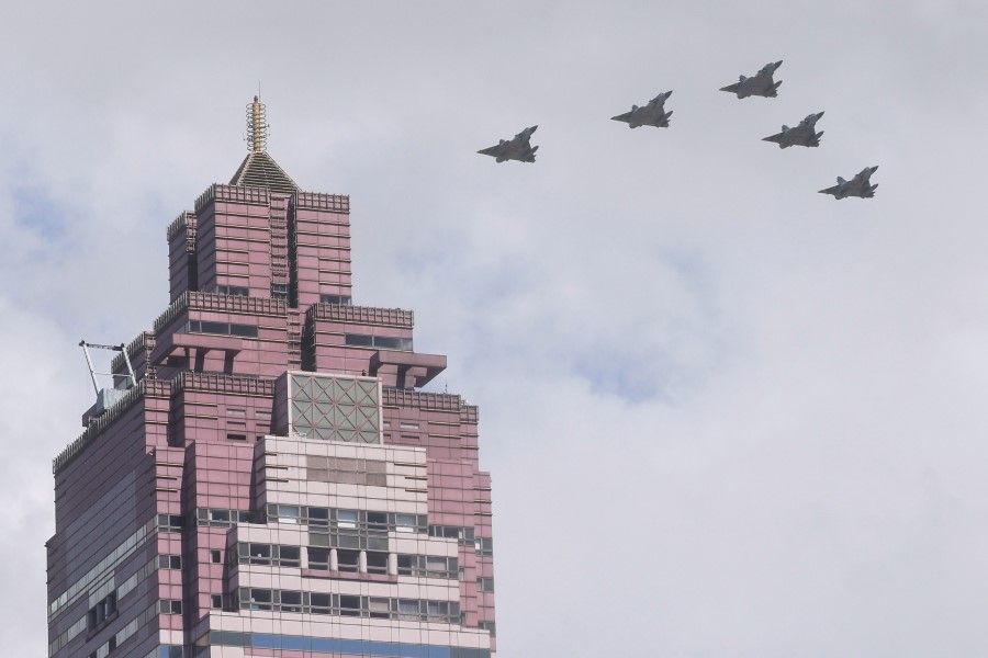 A formation of military airplanes fly during the national day celebration in Taipei, Taiwan, 10 October 2021. (Ann Wang/Reuters)