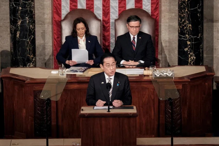 Japanese Prime Minister Fumio Kishida addresses a joint meeting of Congress, as US Vice-President Kamala Harris and House Speaker Mike Johnson (R-LA) listen, at the US Capitol in Washington, US, on 11 April 2024. (Michael A. McCoy/Reuters)