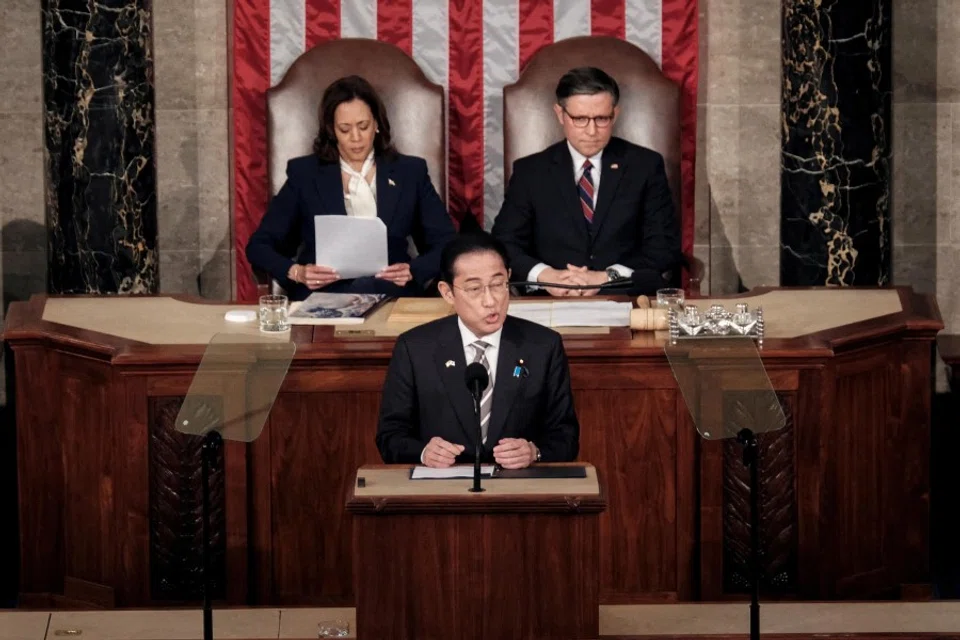 Japanese Prime Minister Fumio Kishida addresses a joint meeting of Congress, as US Vice-President Kamala Harris and House Speaker Mike Johnson (R-LA) listen, at the US Capitol in Washington, US, on 11 April 2024. (Michael A. McCoy/Reuters)
