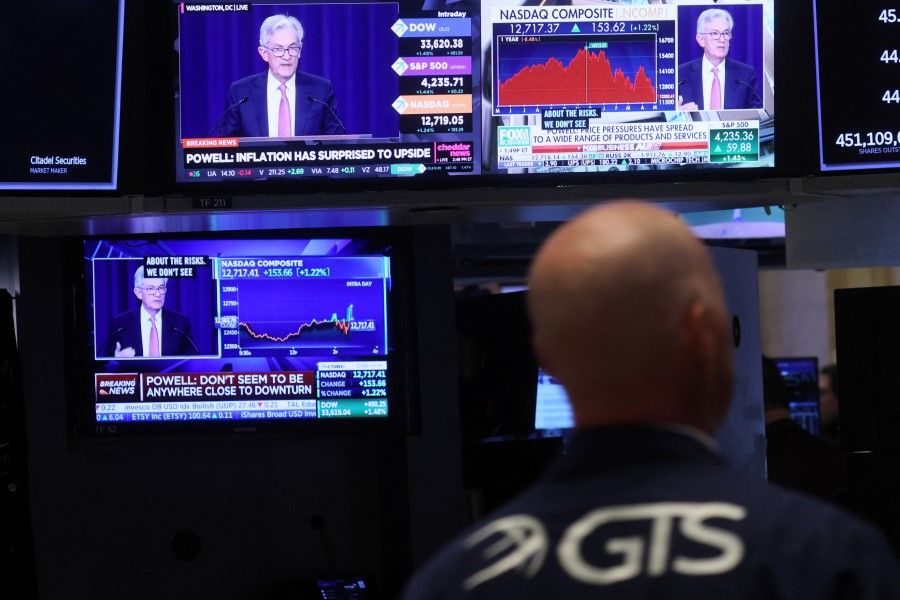 Federal Reserve Chair Jerome Powell is seen delivering remarks on screens, on the floor of the New York Stock Exchange in New York City, US, 4 May 2022. (Brendan McDermid/Reuters)
