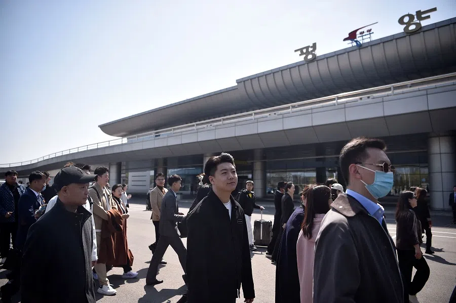 Members of a Chinese art troupe arrive at Pyongyang International Airport in Pyongyang on 9 April 2024, ahead of a joint performance at the opening ceremony for China and North Korea’s ‘friendship year’.  (Kim Won Jin/AFP)