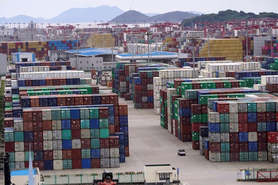 Containers are seen at the Yangshan Deep Water Port in Shanghai, China, 19 October 2020. (Aly Song/Reuters)