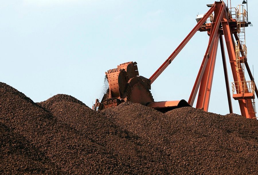 A conveyer belt dumps iron ore into a pile at an iron ore transfer and storage centre operated by the Shanghai International Port Group in Shanghai, China, on 26 January 2010. (Qilai Shen/Bloomberg)